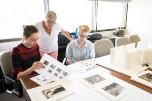 History class looking over old photos