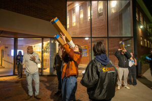 Physics students looking up at stars