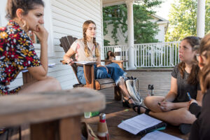 International Development and Social Change - students on front porch talking