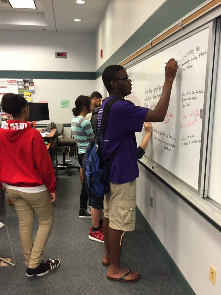 kids writing on caulk boards