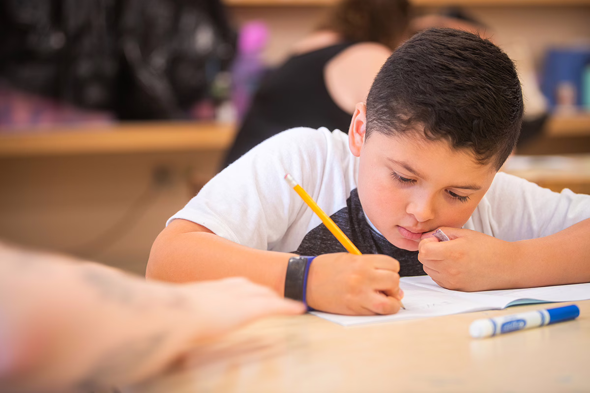 young boy in classroom