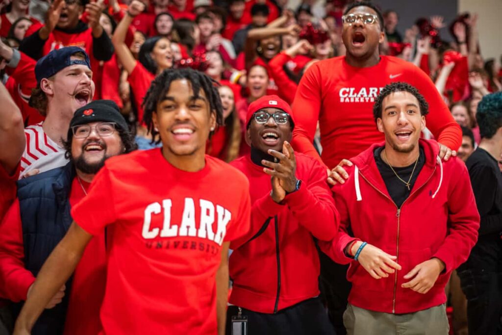 Clarkies wear red in the stands of basketball games