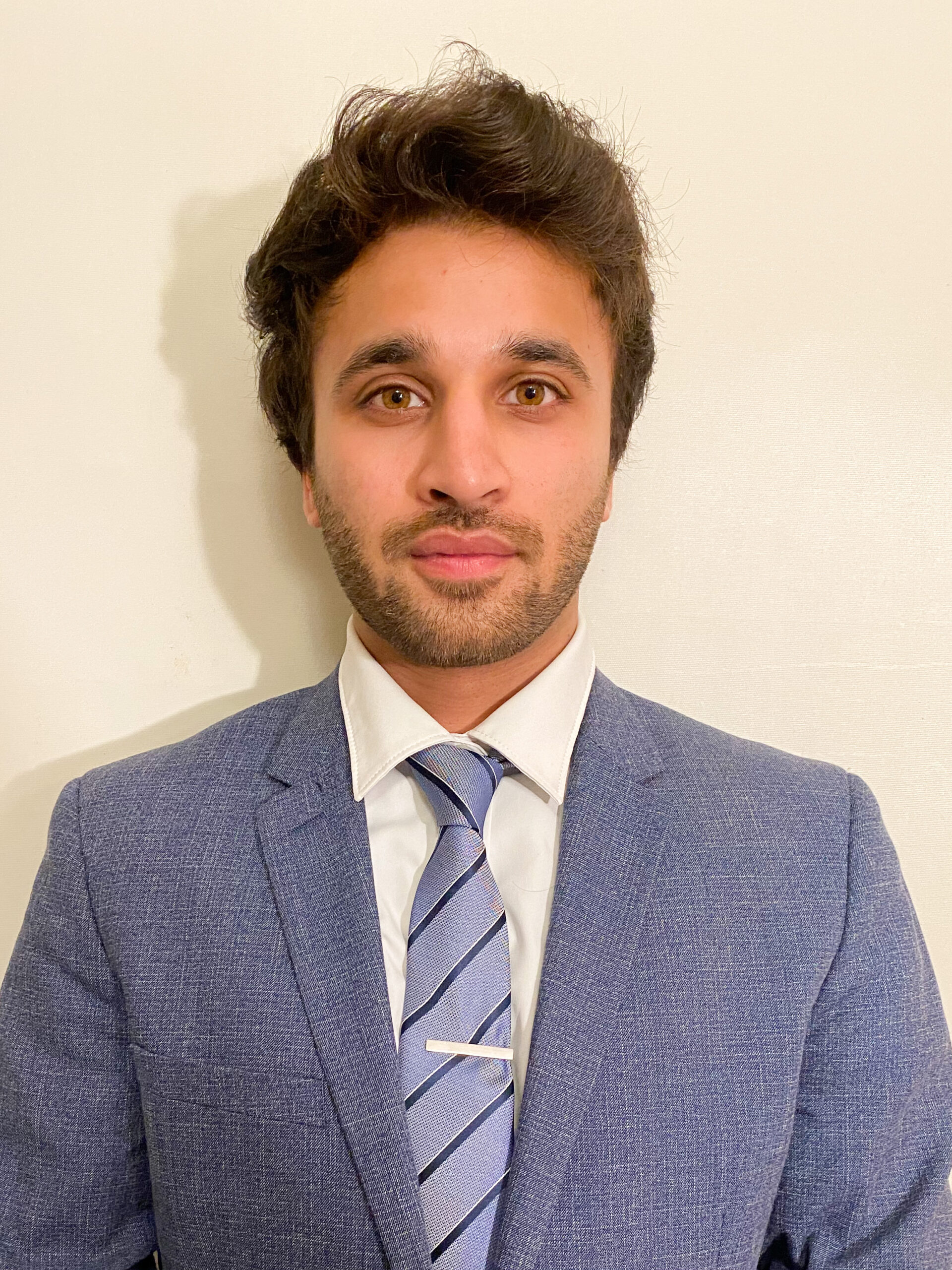 headshot of Faaiz Masood