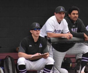 Kyle Bonicki '17 coaching Amherst College baseball during a game