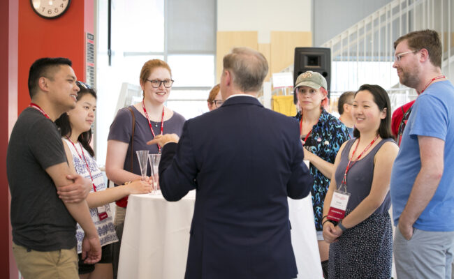 People talking during LGBTQ+ Alumni Reunion Reception