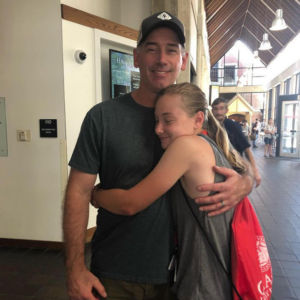 Taylor Laflamme '23, M.S. '24, hugging her dad goodbye