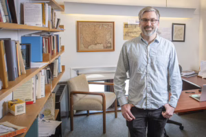 Nathan Braccio in his office at Clark University