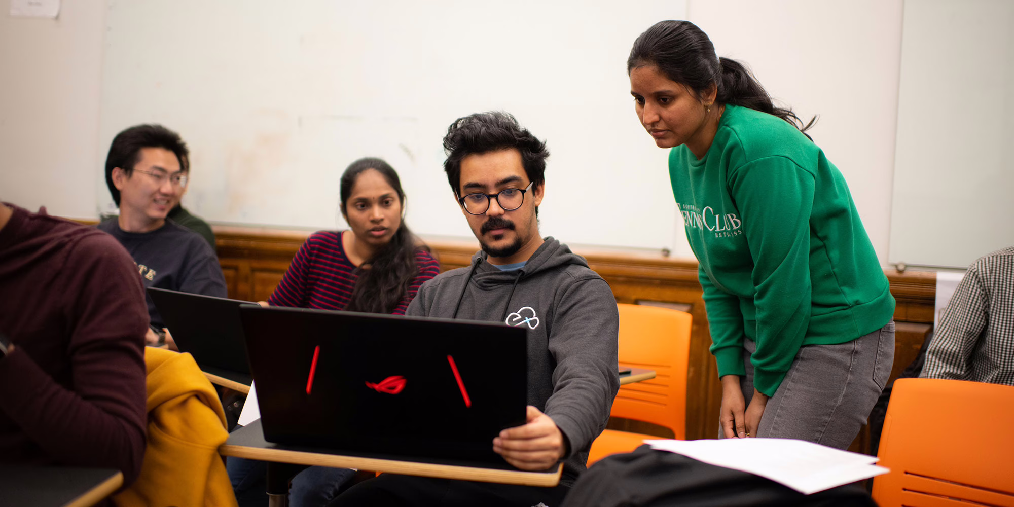 Students working together in business intelligence class