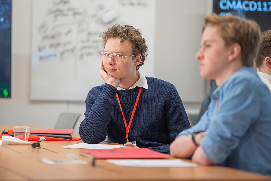 male student observing summit