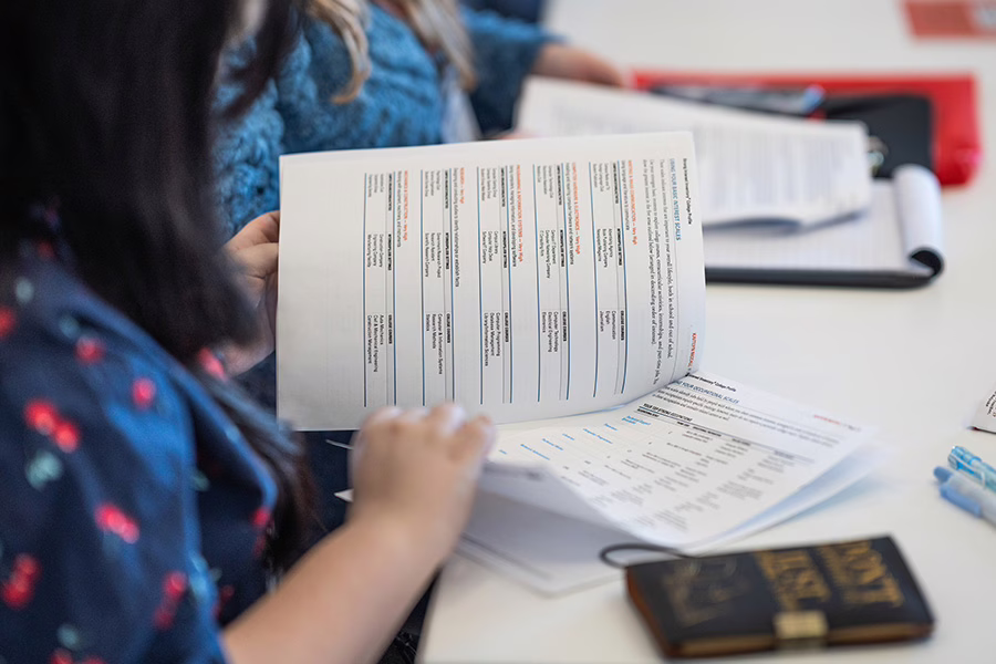 student looking over paperwork