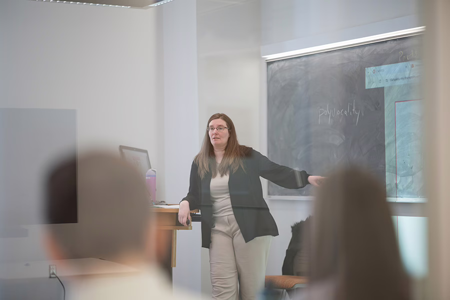 professor showing something on blackboard