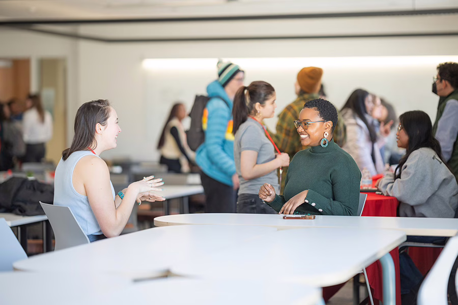 director talking to student at table