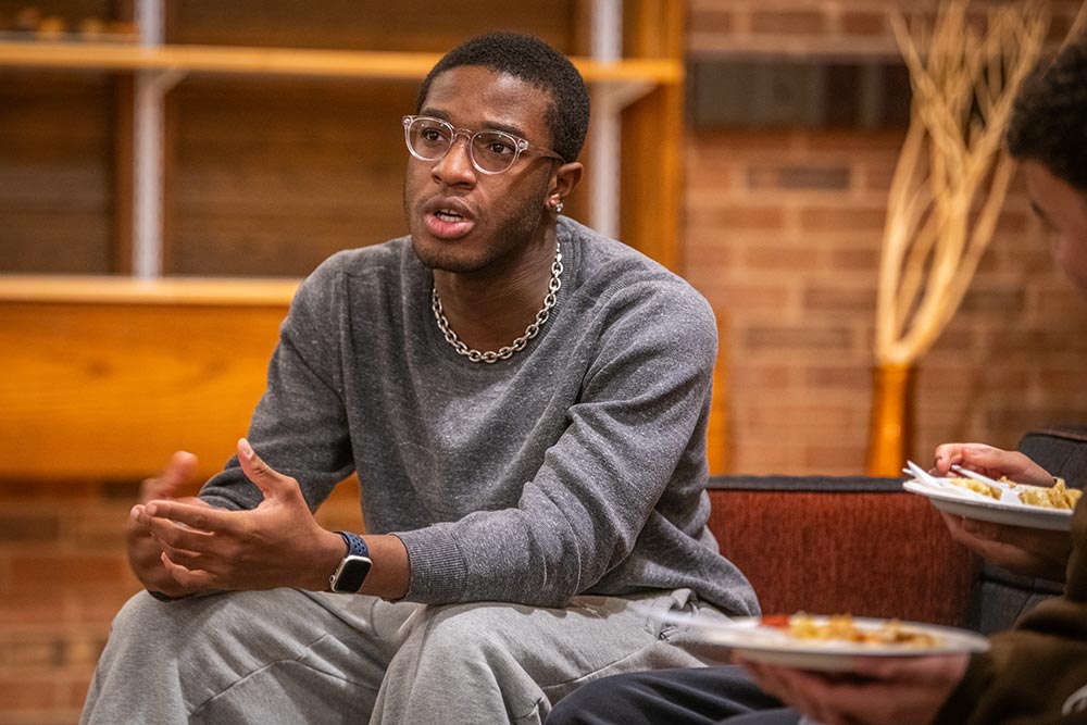 Isaac Tomeho ’26 participates in a discussion with the Men of Color Alliance