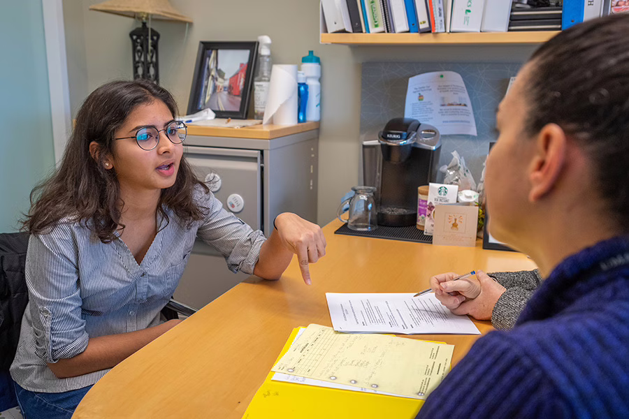 female student working with a counselor