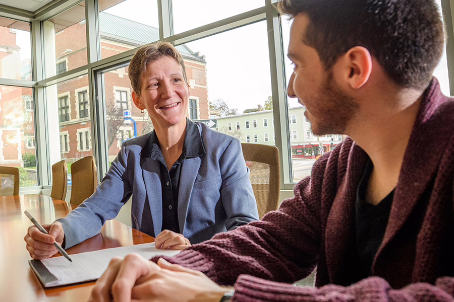 Jennifer plante with student in writing center