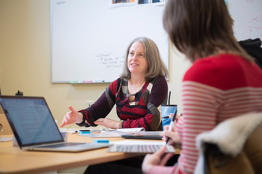 psychology teacher talking to students