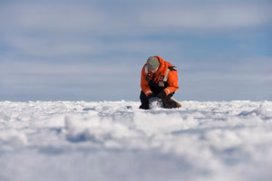 Researcher from Clark University gathering data in the Arctic