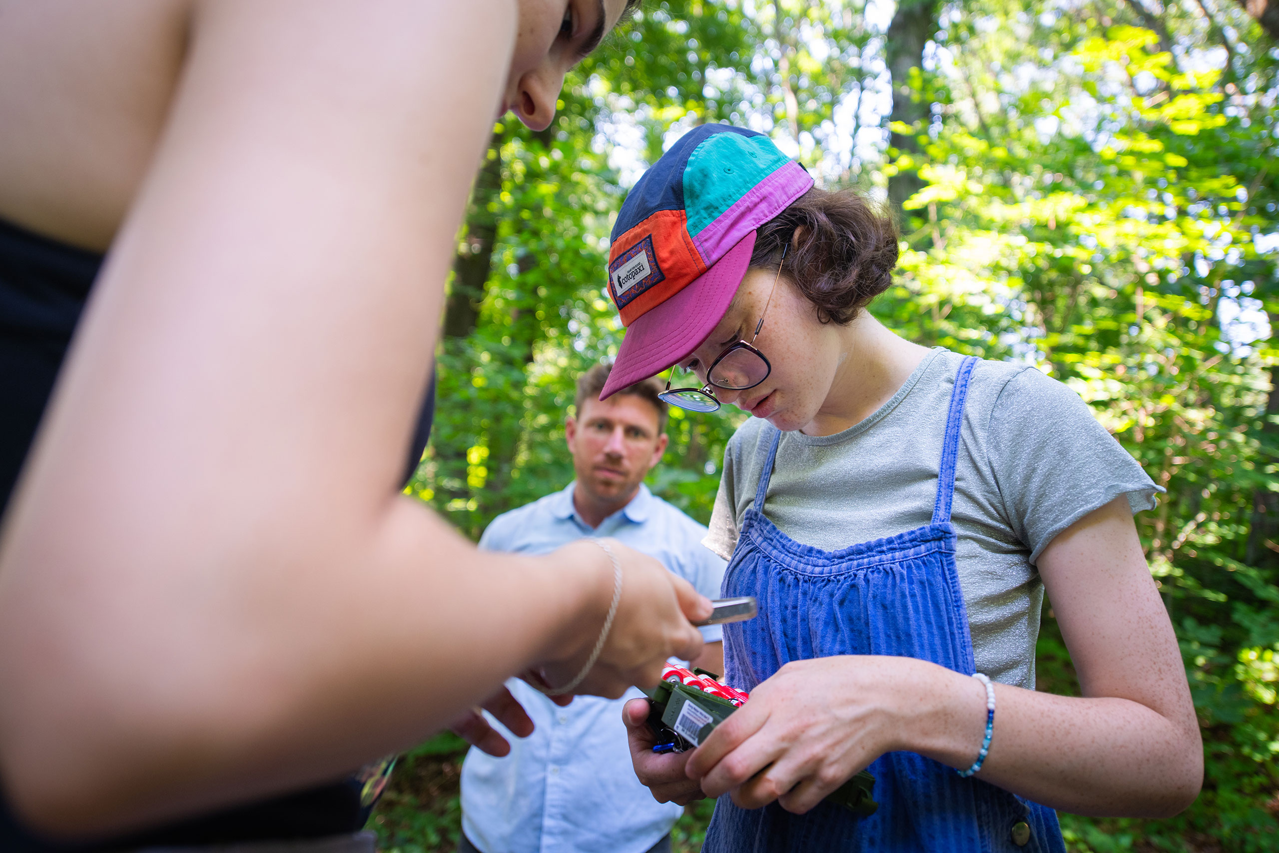 A student installs equipment to monitor bat activity at the Hadwen Arboretum, Clark University