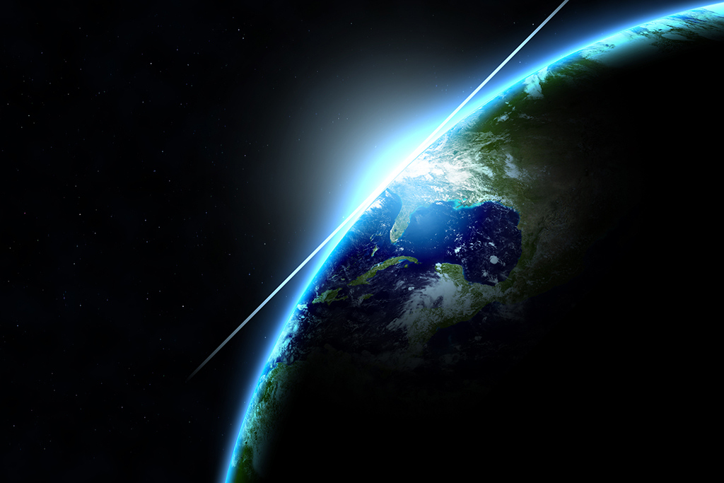 sun coming up over earth