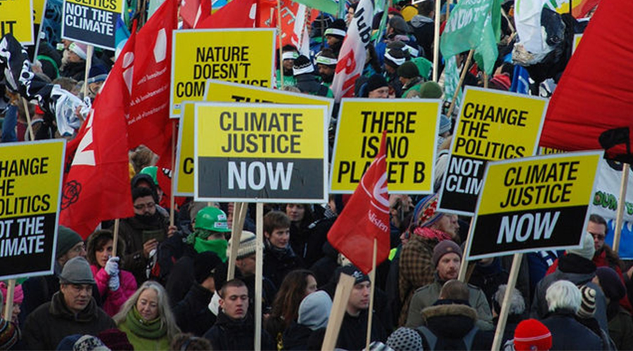 activists holding up climate justie
