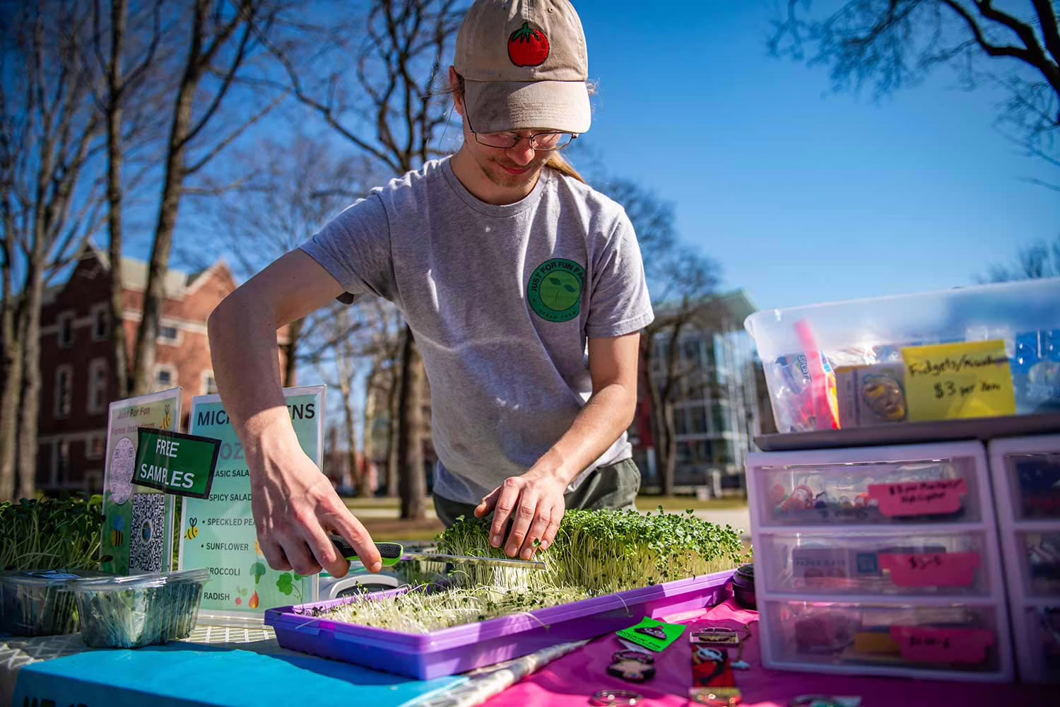Owen Chase selling micro greens on the Clark University campus