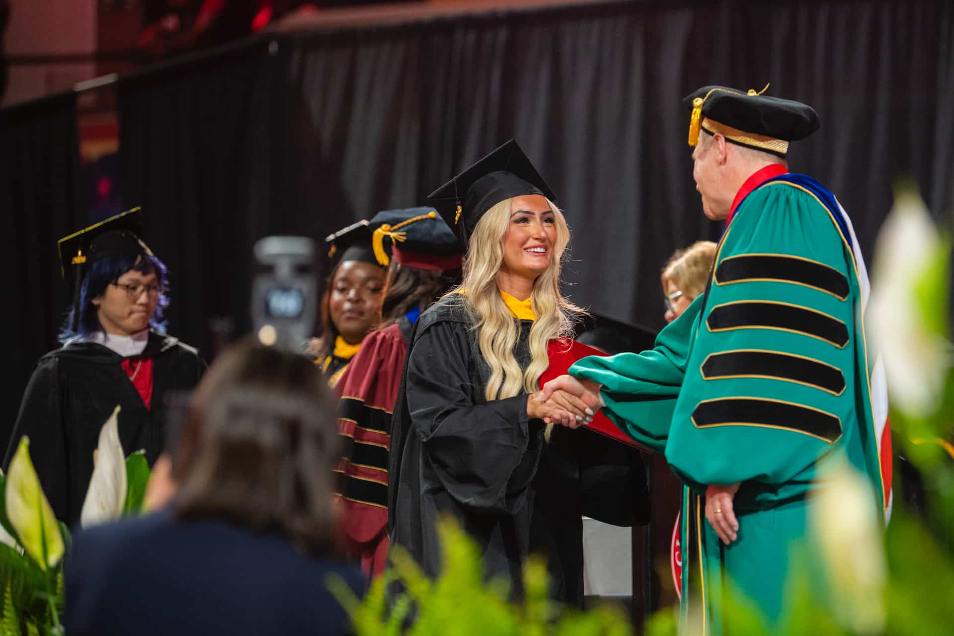 students receive their diplomas