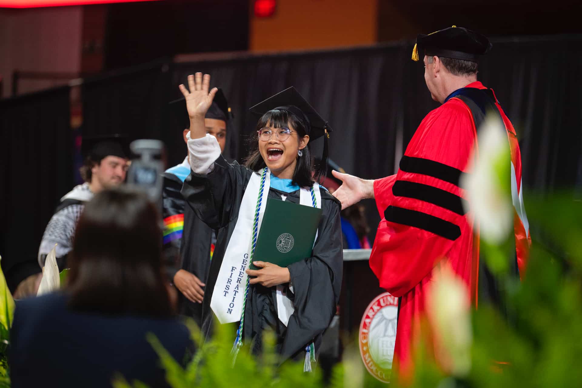 a first generation student receives his diploma