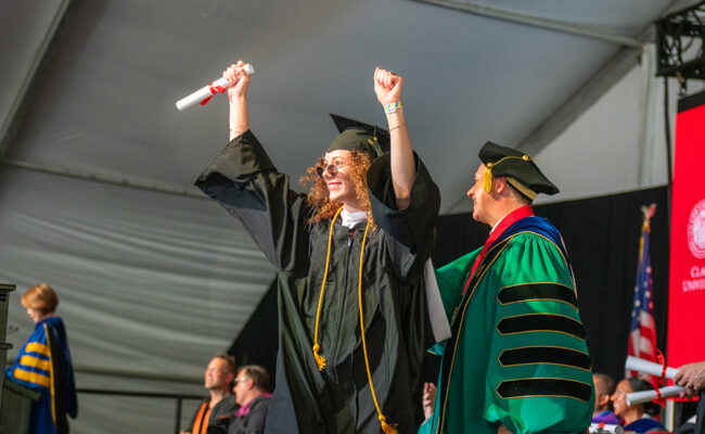 girl receiving diploma at graduation