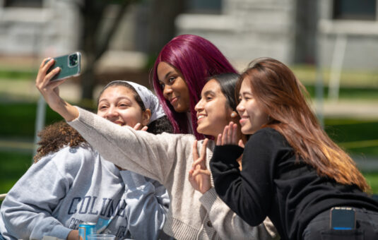 Students taking selfie at senior week BBQ