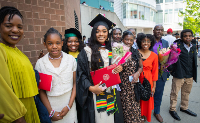 Student smiling with family