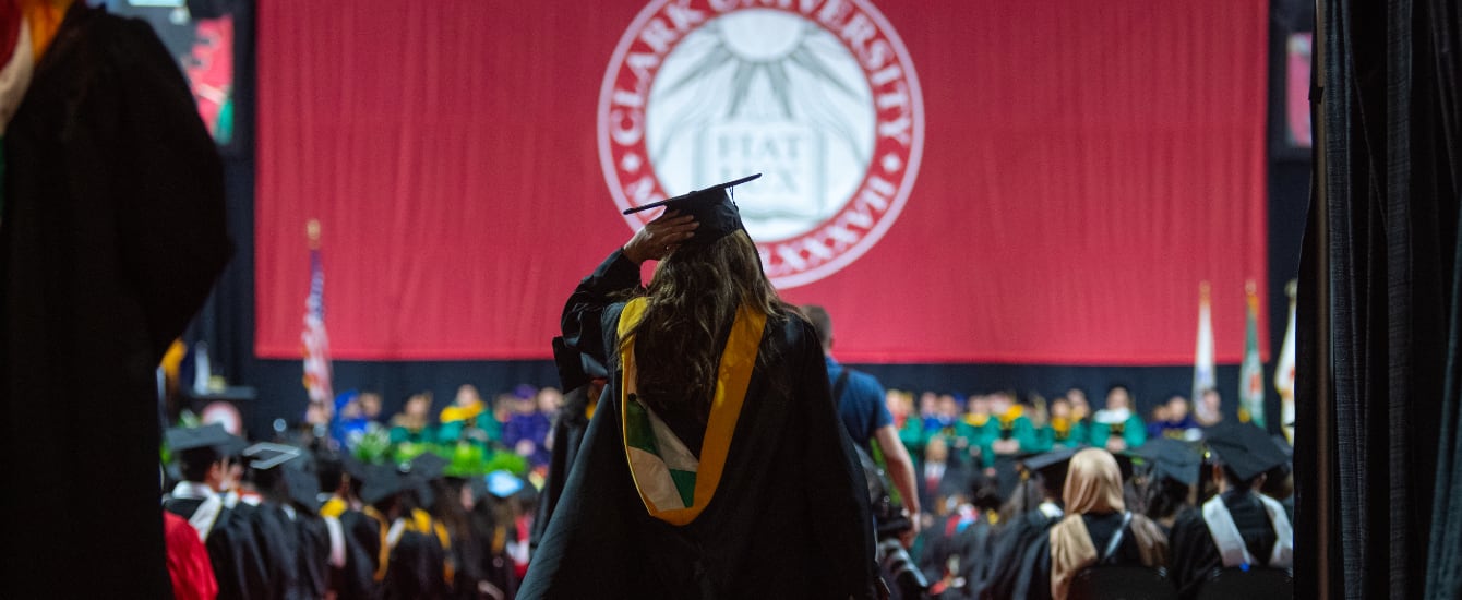 A student walking out towards the stage during Commencement 2024