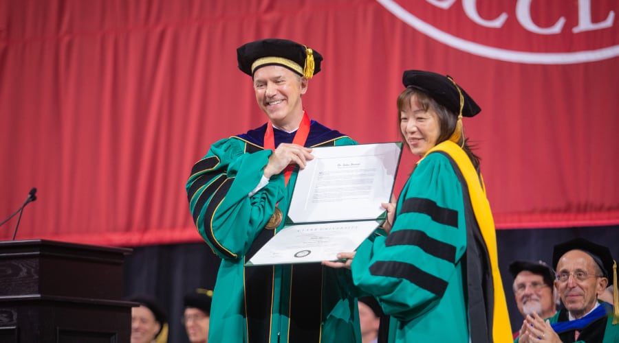 President Fithian confers an honorary degree to Akiko Iwasaki