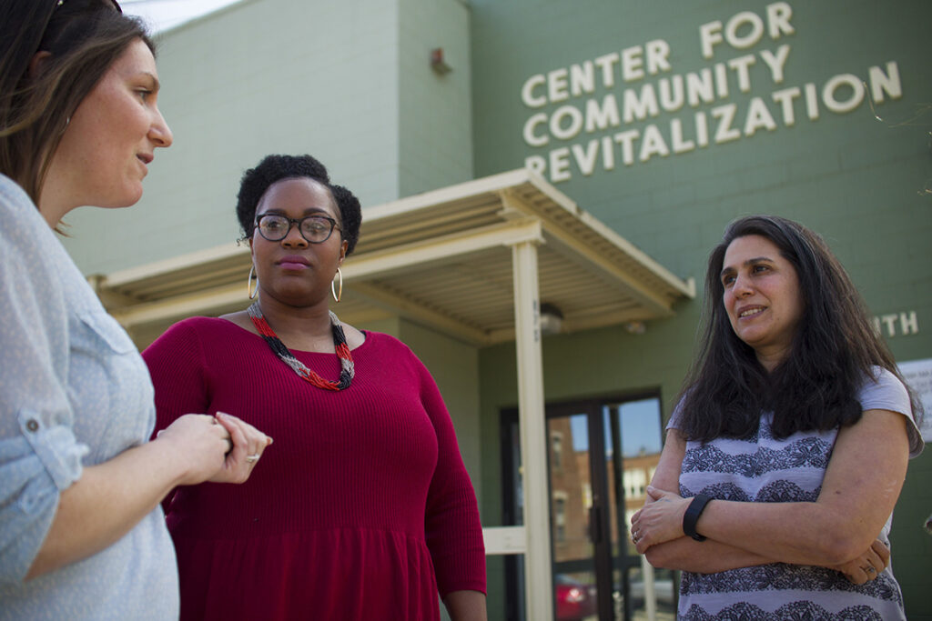 Laura Ross in front of Center for Community Revitalization