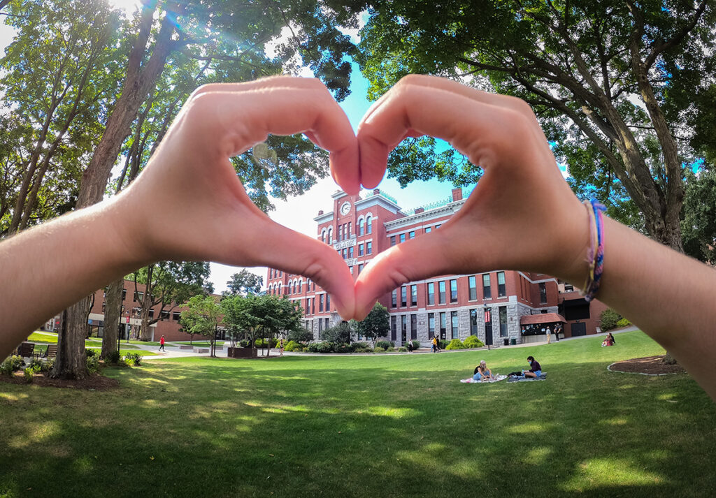hands holding up love sign 