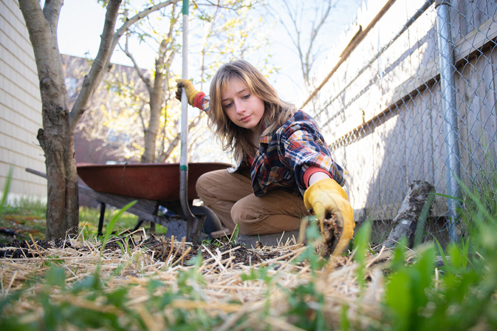 Amanda Dye digging in backyard