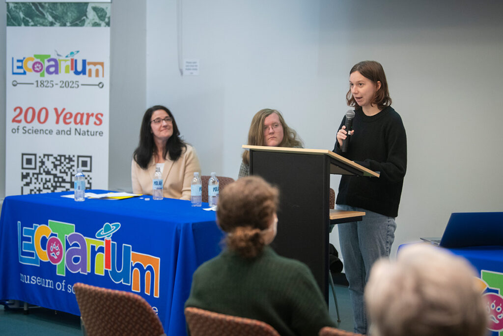 female student talking at podium at Worcester Ecotarium