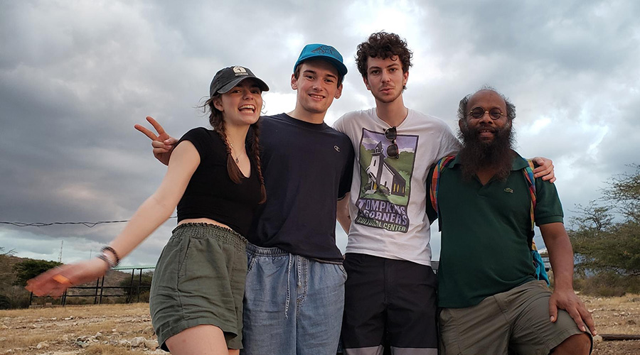 international development students with faculty member posing for camera