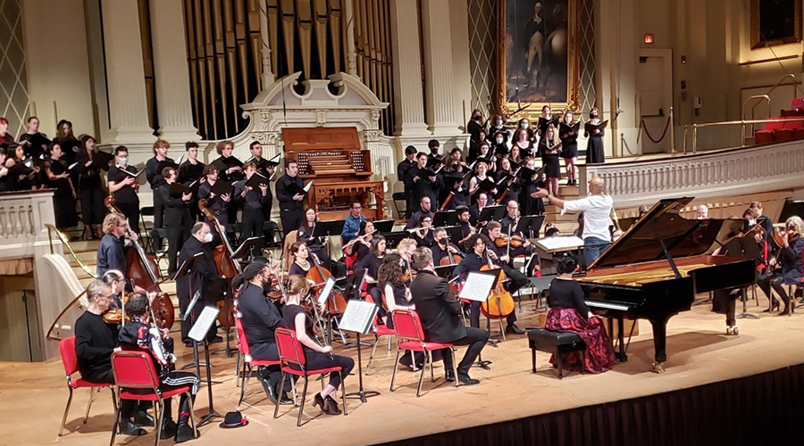 music students in orchestra on stage