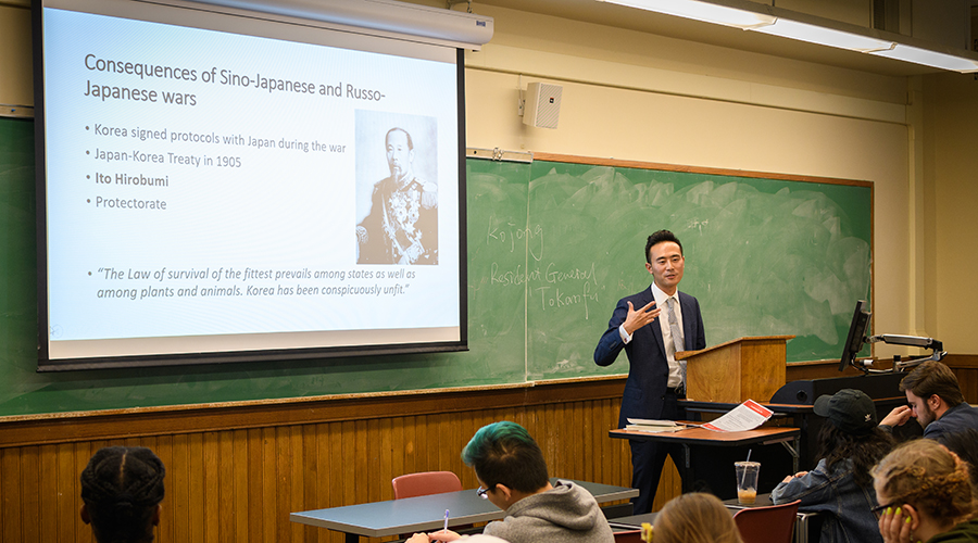 Asian Studies class. Professor showing ppt in front of class.