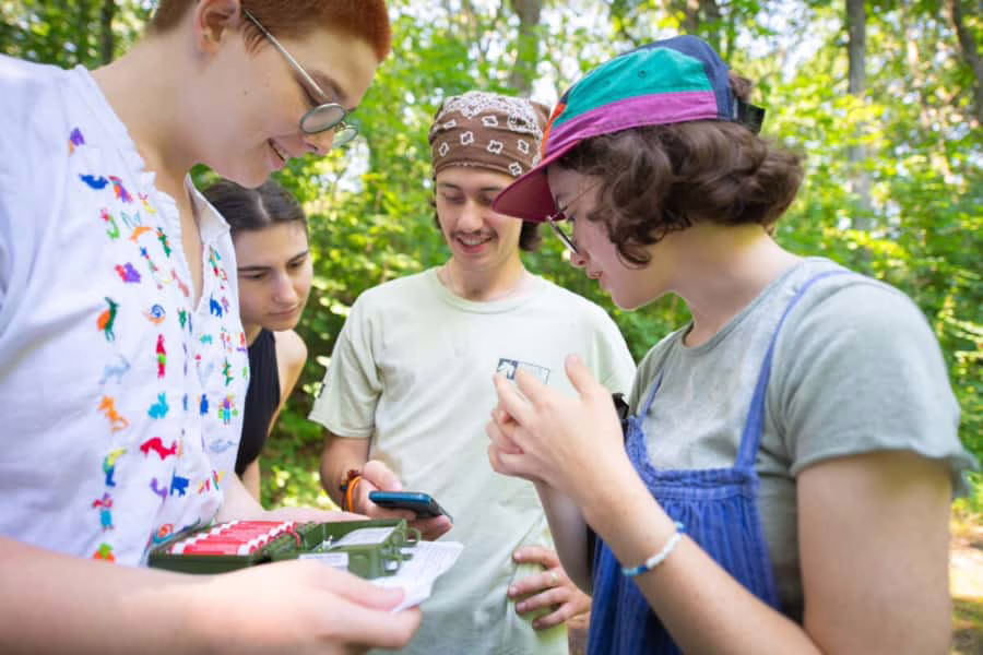 students install wildlife sensors in Hadwen Arboretum