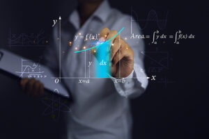 woman writing calculus on board