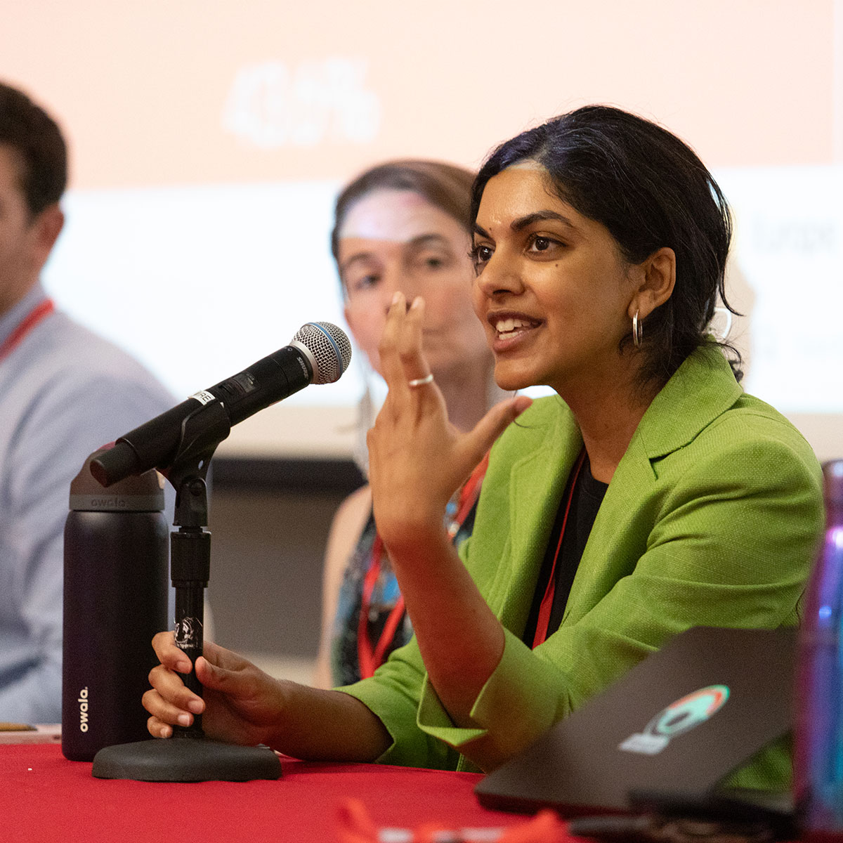 Student speaking at economic geography conference