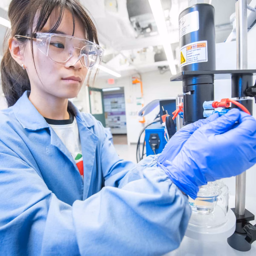 a student wearing safety equipment in the lab