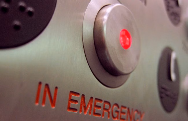 button labeled in case of emergency
