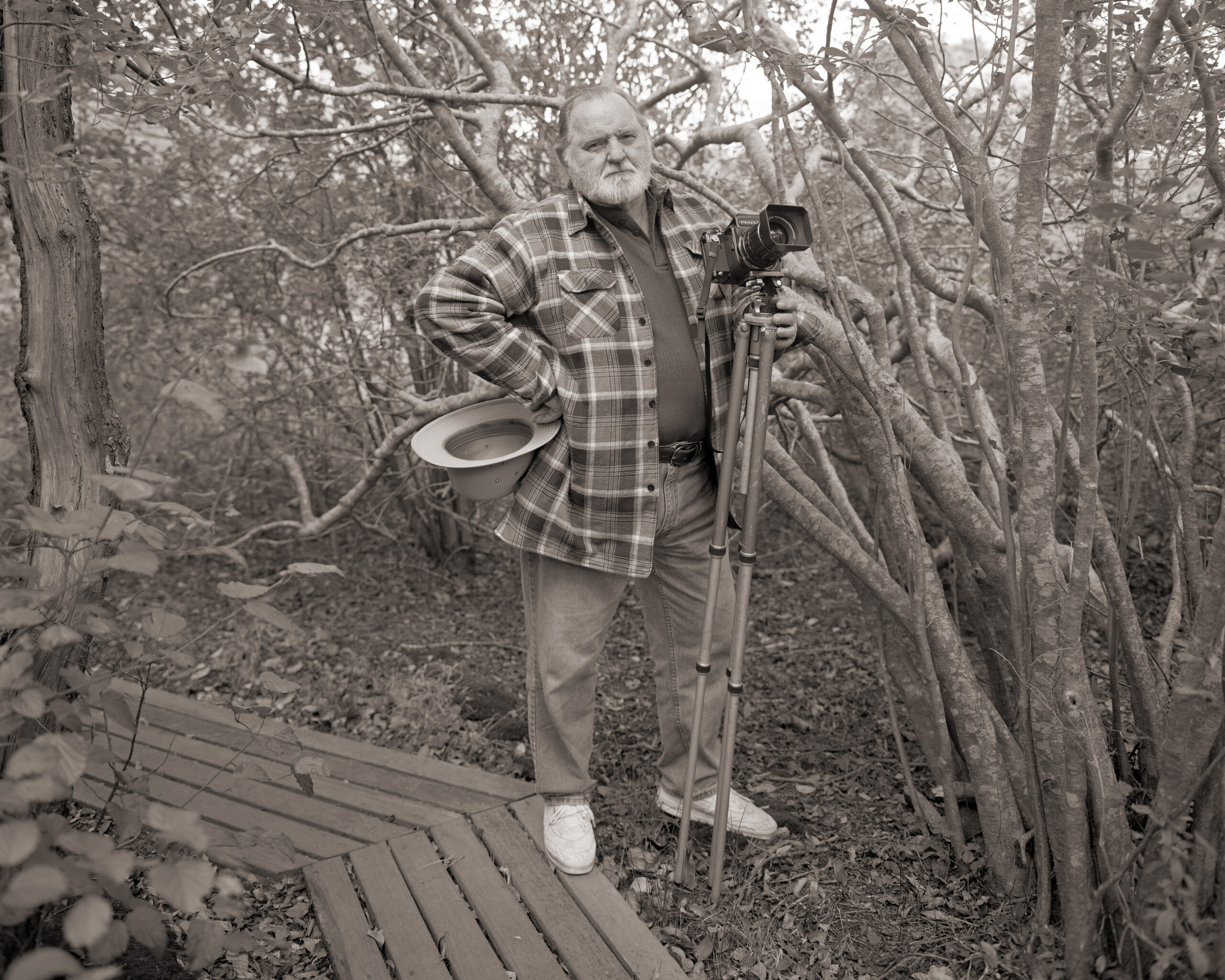 Photographer Frank Armstrong amidst trees