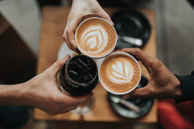 Hands with coffee cups