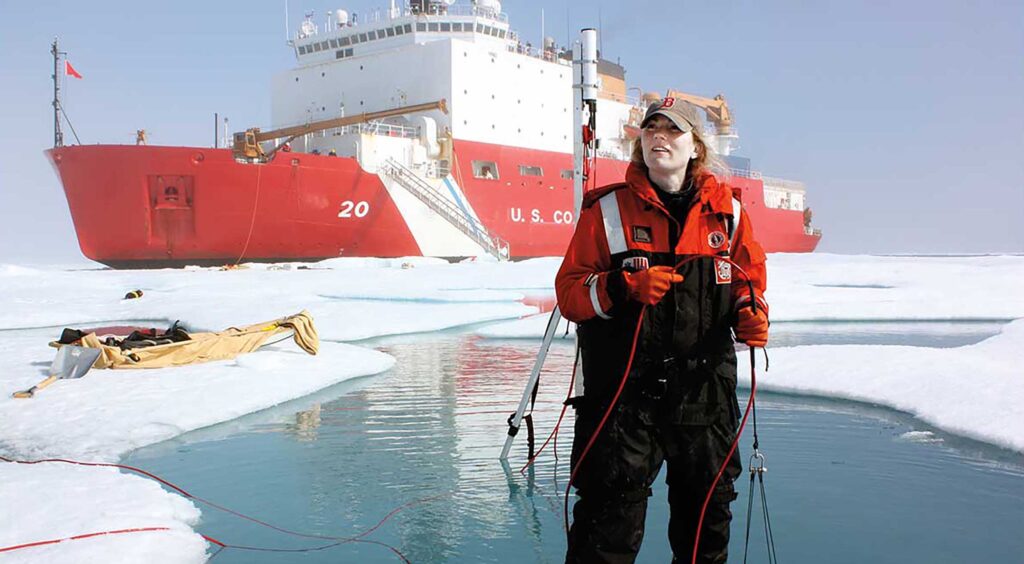 Karen Frey standing on ice near shi