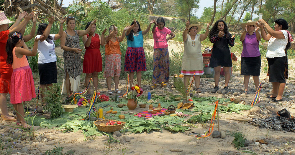 south american woman worshipping food