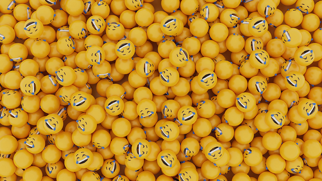 Yellow balls printed with laughing emoji