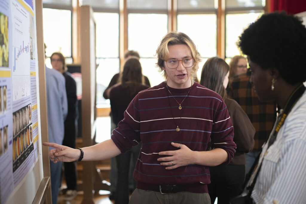 Carter Peterson presents a mycology research project at ClarkFEST